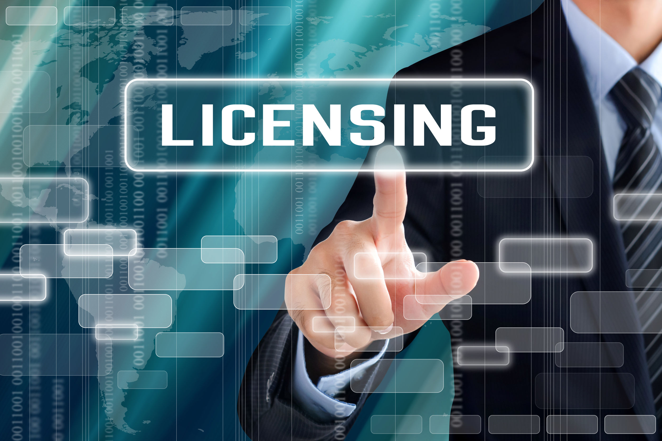 Businessman hand touching LICENSING sign on virtual screen